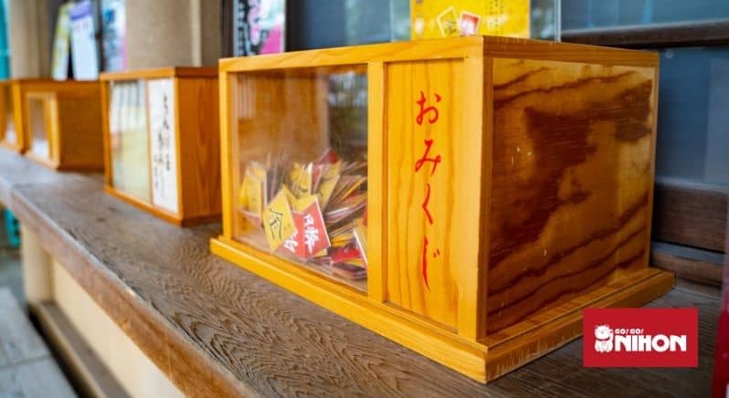 omikuji in a wooden box