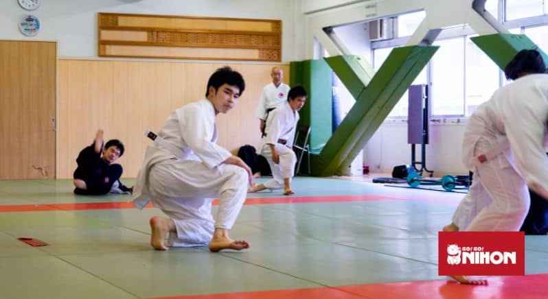 People practicing martial arts, some of the popular sports in Japan.