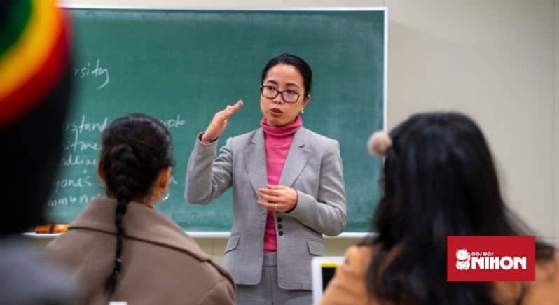 Image of a teacher speaking to a class of students