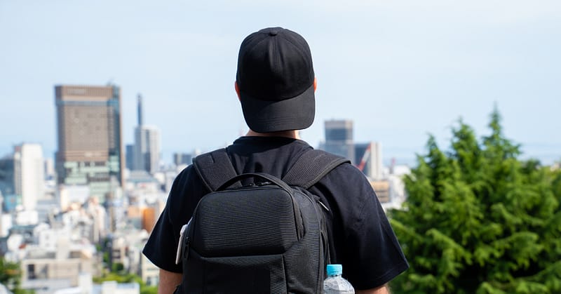 Person looking at a city view of Kitano Ijinkan Town (European village) in Japan.