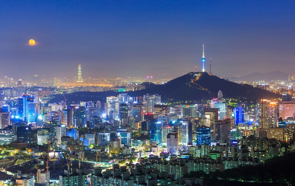 Live & Study in Korea Blog cover image showing Seoul skyline at night